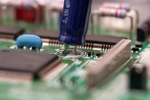 Exploring the intricate world of electronics components on a green printed .. Stock Photos