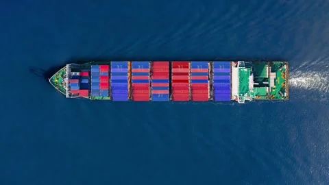 Exploring the journey of a container ship through ocean trade routes Stockbeeldmateriaal 331665104
