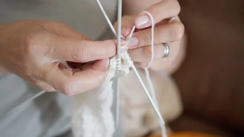 Exploring Knitting Techniques Mastering the Art of Crafting Beautiful Items with Stock Footage 314619279