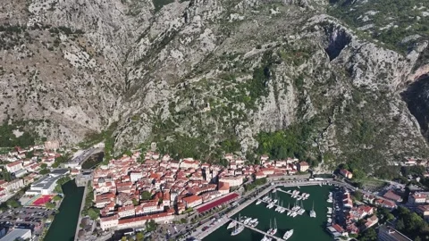 Exploring Kotor Old Town with its stunning architecture, lush mountains, and Video stock 287781624