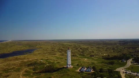 Exploring the landscape around the lighthouse on a clear day in a coastal are Stock Footage 339940044