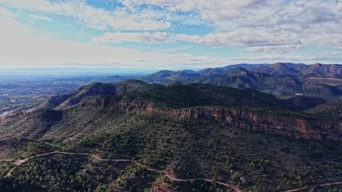 Exploring the landscape of Spain with hills and valleys on a clear day Stock Footage 327646678