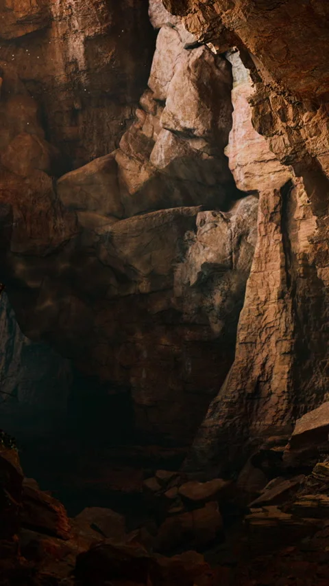 Exploring a large cave with rock formations and natural light at sunset Stock Footage 341251418