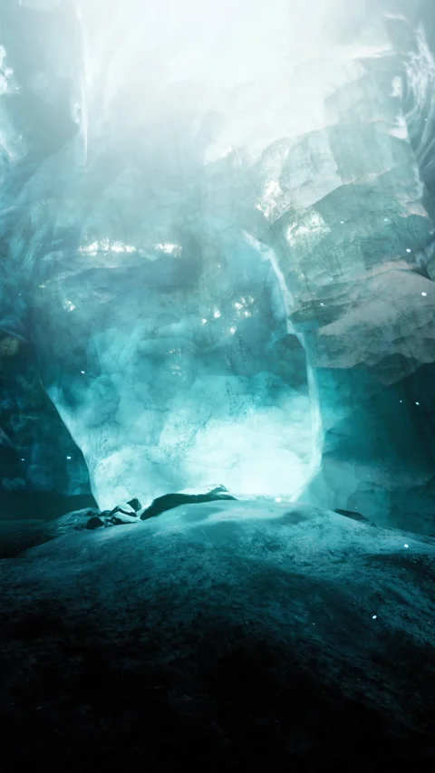 Exploring a large ice cave with bright light shining through the entrance Stock Footage 337974369