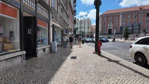 Exploring Lisbon pov through narrow colorful streets in bright summer day Portug Stock Footage 314017816