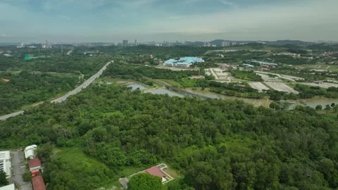 Exploring lush greenery and expansive highways in a vibrant urban landscape Stock Footage 311986881