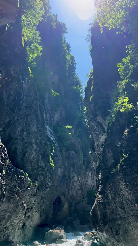 Exploring the Majestic Cliffs and Sunlight in a Stunning Canyon at Midday Stock Footage 314394131