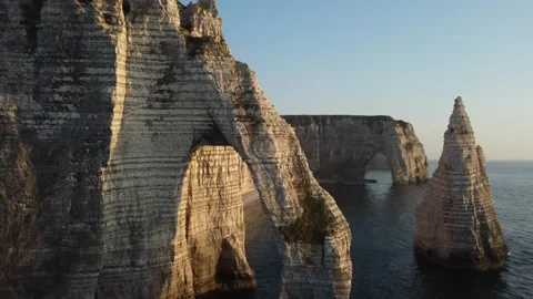 Exploring the Majestic Cliffs of Etretat at Sunset Stock Footage 280305653