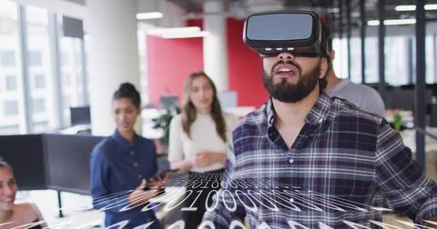 Exploring man wearing VR headset interacting with binary code overlay at modern Stock Photos