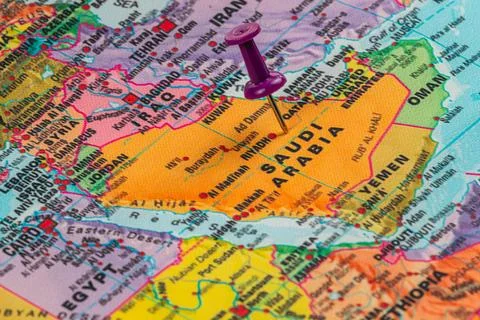 Exploring the map of Saudi Arabia with a pushpin marker Stock Photos