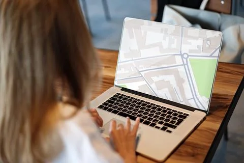 Exploring a map for taxi locations while planning travel routes in the cafe Stock Photos