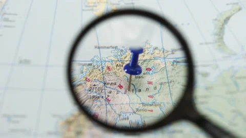 Exploring the marked location on a paper map of Europe Stock Footage 340078856
