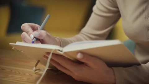 Exploring mindfulness through journaling in a cozy environment Video stock 303768529