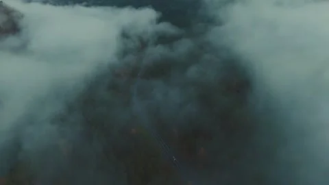 Exploring the misty valley landscape at dawn in the mountains Stock Footage 294010804