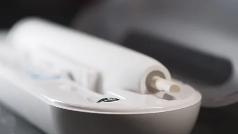 Exploring a modern dental care device at a home setting Stock Footage 306638515
