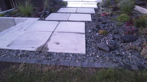 Exploring a Modern Garden Pathway Design With Landscaping Details in a Stock Footage 284357766