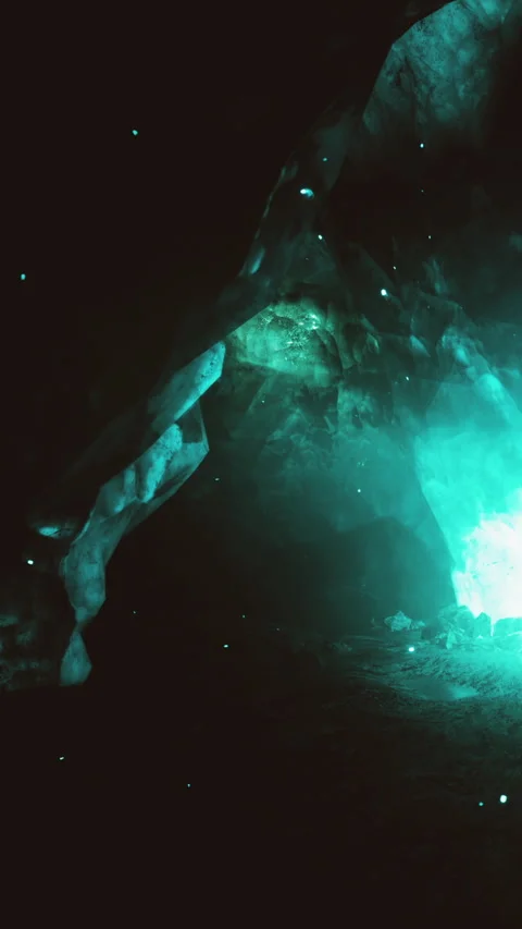 Exploring a natural cave with glowing rocks and a dark background Stock Footage 338002858