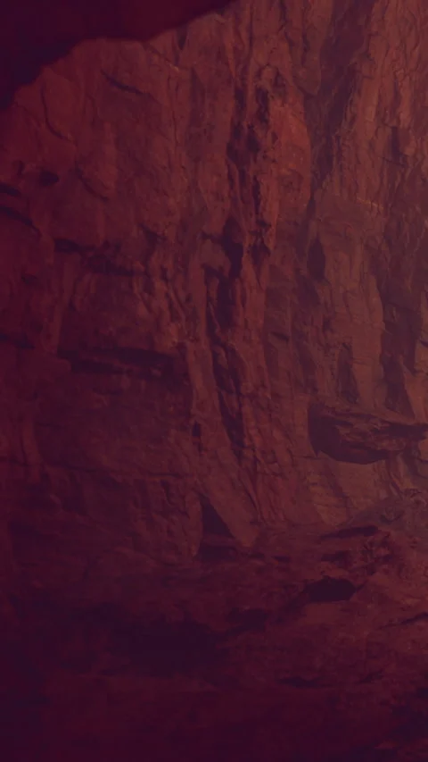 Exploring a natural cave with rock formations at night in a dark environment Stock Footage 341987301