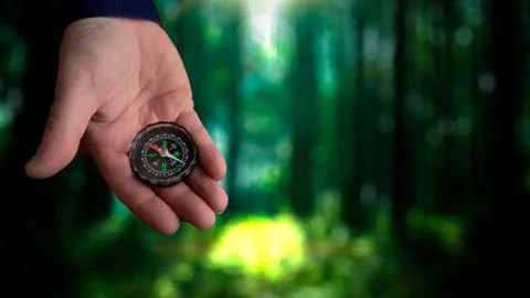 Exploring nature with a compass in hand Stock Photos