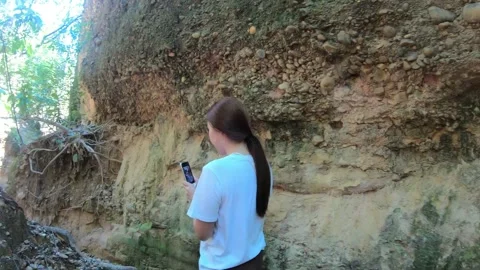 Exploring Nature with a Smartphone in Hand Stock Footage 329374885