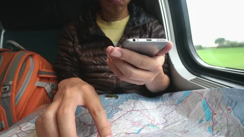 Exploring New Places with a Map and Smartphone Stock Footage 315782016