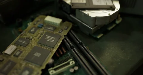 Exploring old computer components with circuit boards and hard drives Stock Footage 312271855