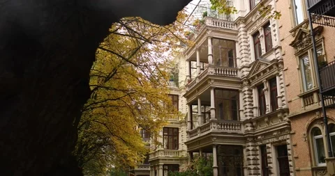 Exploring a old german residential are during fall with golden autumn leaves Stock Footage 230490181