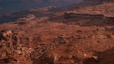 Exploring the Otherworldly Landscape of Barren Red Terrain at Dusk Stock Footage 346688422
