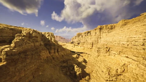 Exploring outdoor terrains beneath expansive open sky with challenging paths Stock Footage 339620270