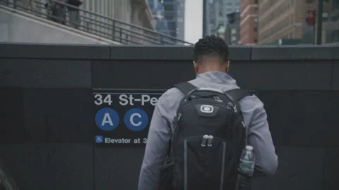 Exploring penn station with the walking man: discovering new york city Stock Footage 312591707