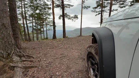 Exploring the pristine landscapes of Siberia while riding an SUV through Stock Footage 309466833