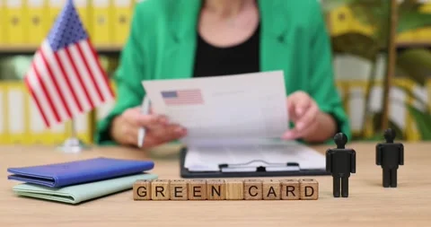 Exploring the process of applying for a green card in a welcoming office Stock Footage 319646232