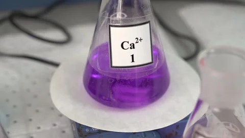 Exploring the Purple Calcium Solution Within a Laboratory Setting for Stock Footage 300489567