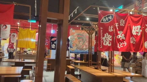 Exploring a Quaint Japanese Eatery with Hanging Banners Stock Footage 248962514