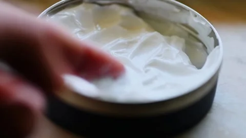 Exploring Quality: Testing Face Cream in Container - 4k Stock Footage 267892378