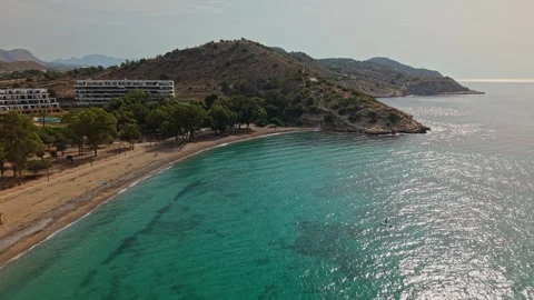 Exploring a quiet beach in a coastal area with clear water and smooth sand .. Stock Footage 340191649