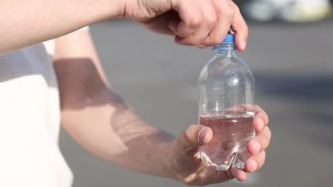 Exploring the Refreshing Experience of Hydration: A Journey with Plastic Water Stock Footage 314460519