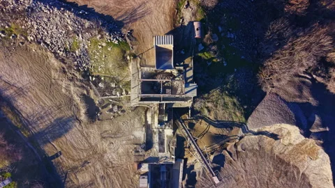 Exploring the remnants of a forgotten construction site lost in nature's embrace Stock Footage 332027609