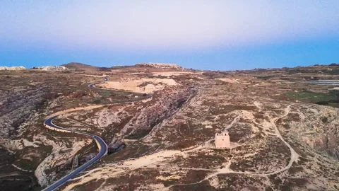 Exploring a Remote Area With Winding Roads and a Historic Tower in Malta During Stock Footage 334934491