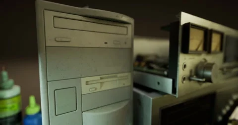 Exploring a retro computer and vintage audio equipment in a dimly lit room Stock Footage 316077881