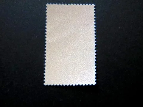 Exploring the Reverse Side of a Unique Postage Stamp in a Philatelic Collec.. Stock Photos