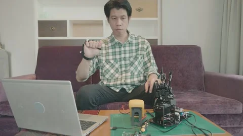 Exploring Robotics: A Hands-On Approach to Technology and Innovation Stock Footage 319415133