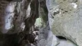 Exploring a rocky cave formation with lianas and stoned coral fossil in Flores 4k or 4k+ Resolution