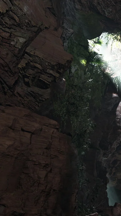 Exploring a rocky cave with light shining through at a remote location Stock Footage 340256367