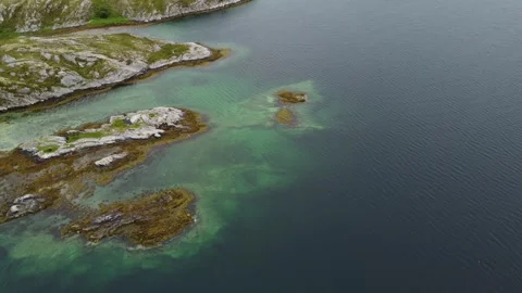Exploring rocky islands in clear water near the coast Stock Footage 340503110