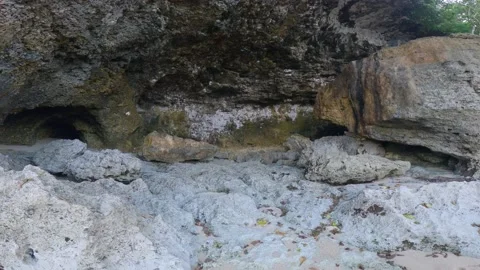 Exploring Rocky Shoreline Caves Stock Footage 237561838