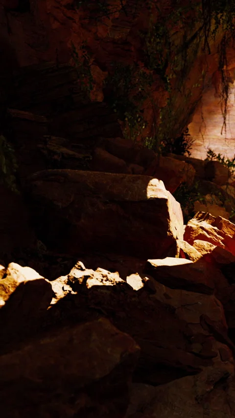 Exploring rocky terrain in a cave during the day Stock Footage 339399170