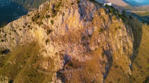 Exploring the Rugged Beauty of Mountain Terrain in Vibrant Sunset Hues. Maratea, Stock Footage 318387561