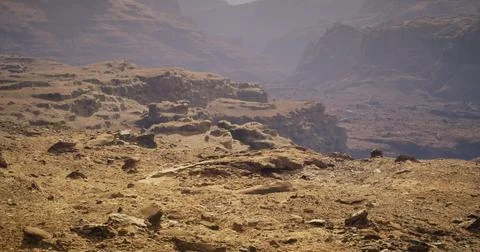 Exploring a rugged landscape with dramatic rock formations at dusk Illustrazione stock