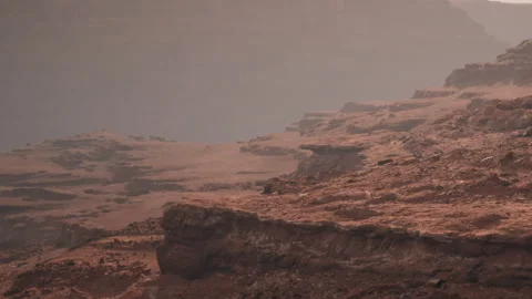 Exploring the Rugged Terrain of a Martian Landscape at Twilight Stock Footage 346688329